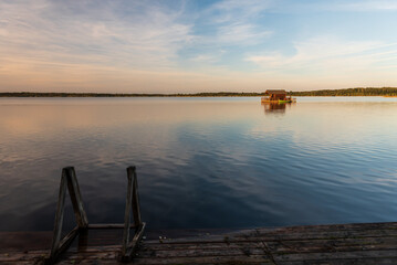 Fototapeta na wymiar A house on a raft in Lielauce Lake.