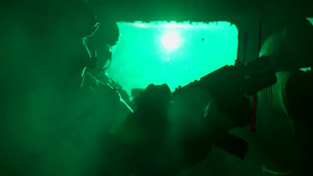 soldiers with guns sitting inside automobile, preparing for shooting and attack, silhouettes of men