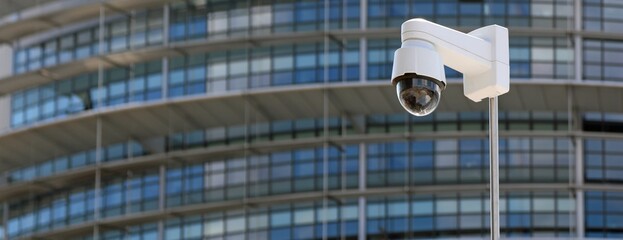 surveillance camera with the skyscraper building of the metropolis in the background