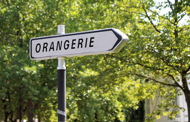 sign with arrow towards ORANGERIE in France in public park
