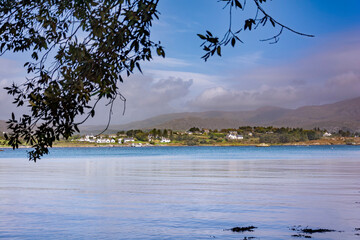 View of the sea and an island with clouds over the sea