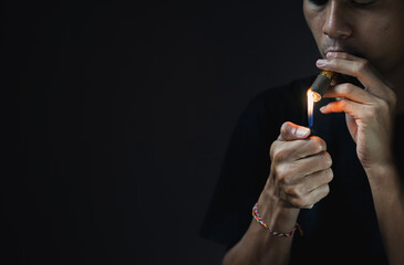 Fototapeta premium A man smoking a cigar.