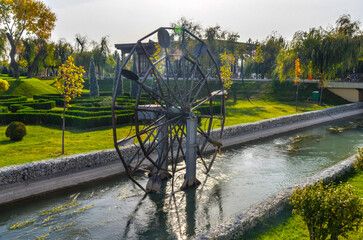 water wheel on Anhor canal  in National Park of Uzbekistan named after Alisher Navoi in Tashkent