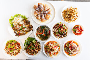 Somtum - Spicy Papaya Salad, Grilled pork neck, Larb moo - Spicy Minced Pork Salad and Crispy Fried Mushroom.Salad with Grilled Pork Neck.Blue Crab Salad. Three Mushroom Curry. 