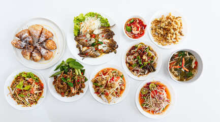 Top view : Somtum - Spicy Papaya Salad, Grilled pork neck, Larb moo - Spicy Minced Pork Salad and...