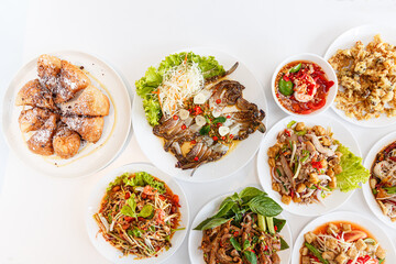 Top view  Somtum - Spicy Papaya Salad, Grilled pork neck, Larb moo - Spicy Minced Pork Salad and...