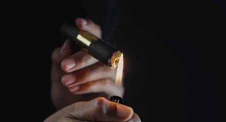 Foto op Plexiglas A man smoking cigar in dark room © wdnld