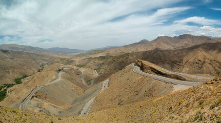 Asphalt road with many turns from Мarrakesh to mountain pass Tizi n'Tichka in Morocco