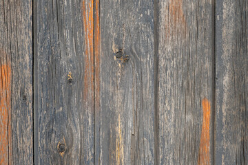Fototapeta premium Background made from old boards exposed to the environment, with traces of old paint.
