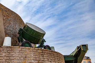 military installation of a world war ii era headlight in the street on the coast of arromanches...