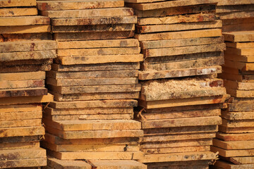 Heap of wood planks for building construction or housing wall. Abstract Wooden Texture Banner With Text copy empty blank space. Wood and building materials shop