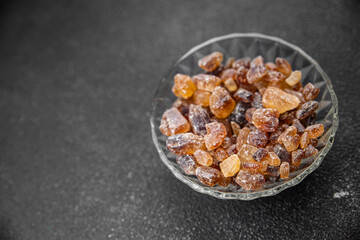 cane sugar crystal rock pieces candy brown sugar candied big rock caramel crystalssugar  taste eating cooking appetizer meal food snack on the table copy space food background rustic top view