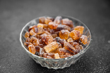 cane sugar crystal rock pieces candy brown sugar candied big rock caramel crystalssugar  taste eating cooking appetizer meal food snack on the table copy space food background rustic top view