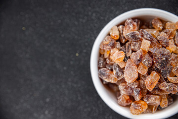 cane sugar crystal rock pieces candy brown sugar candied big rock caramel crystalssugar  taste eating cooking appetizer meal food snack on the table copy space food background rustic top view