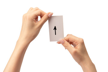 Arrow sign on a card in a woman hand isolated.