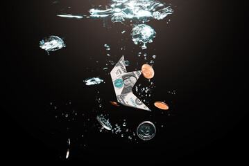 Money concept showing US Dollar sinking in water.
Global financiall crisis concept. Dramatic image of US Dollar sinking in water.