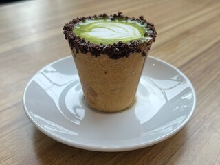 Eatable cup of Green Tea coffee latte