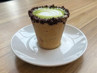 Eatable cup of Green Tea coffee latte