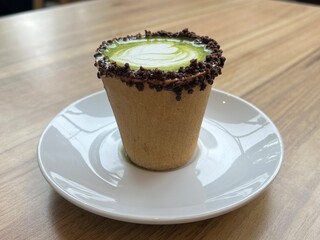 Eatable cup of Green Tea coffee latte