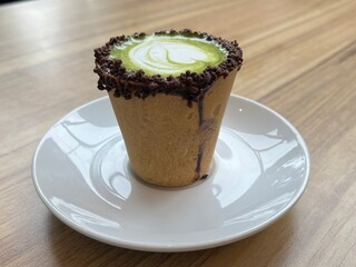 Eatable cup of Green Tea coffee latte