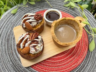 Eatable cup of Coffee and baked potatoes with chocolate mixed milk ice cream