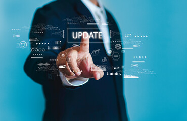 Businessman uses virtual finger to touch Update software applications and hardware upgrade technology concepts.