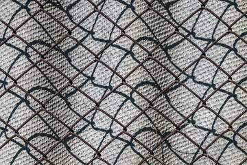 slate and metal mesh as background
