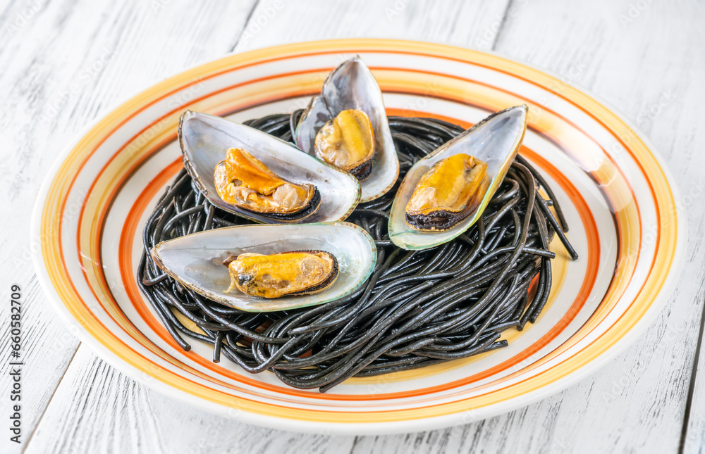 Sticker black pasta with mussels