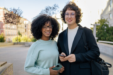 Portrait of two friends looking at camera