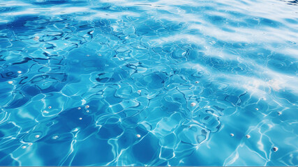 Obraz premium Rippled water surface of clearly transparent water in sea, pool, ocean, bright blue water with sunlight glitter effect background