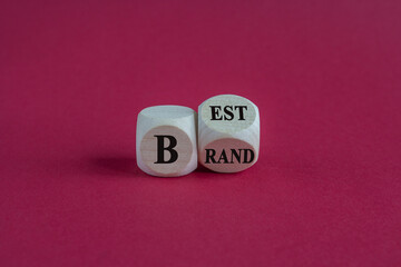 Build your best brand symbol. Concept words Best Brand on wooden cubes. Beautiful red table red background. Build your best brand and business concept. Copy space