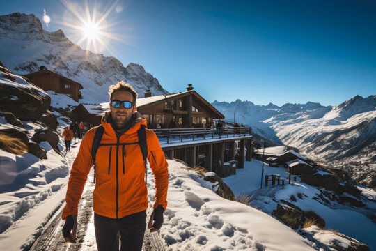 A man in an orange jacket standing in the snow. Imaginary AI picture. Sport in winter mountains.