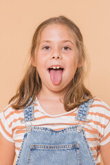 girl in close-up sticking out her tongue