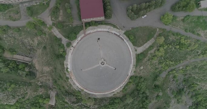 Top down footage over the Herouni Mirror Radio Telescope (ROT54) on a cloudy day in Orgov, Armenia