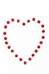 Heart made of red gummy candies isolated on a white background