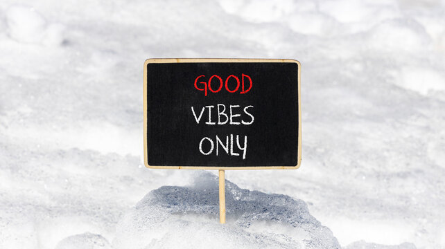 Good vibes only symbol. Concept word Good vibes only on beautiful black chalk blackboard. White snow. Beautiful white snow background. Business motivational good vibes only concept. Copy space.
