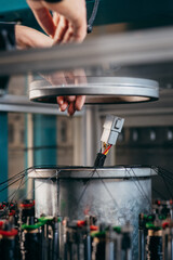 Operator working on braiding machine