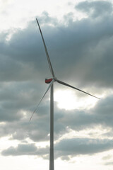 Wind turbines against the background of the evening cloudy sky