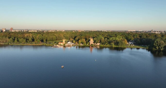 Aerial drone view of Kralingse Plas, highlighting the Plasmolens, De Lelie, and De Ster windmills