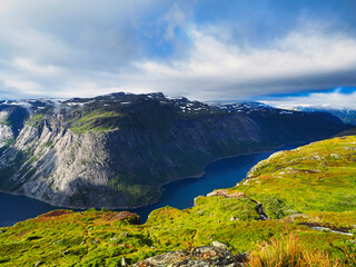 view of a fjord at the top of a cliff on the trolltunga hike