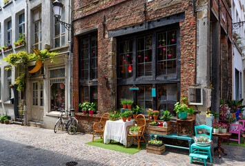 Old street with flower shop in historic city center of Antwerpen (Antwerp), Belgium. Cozy cityscape of Antwerp. Architecture and landmark of Antwerpen