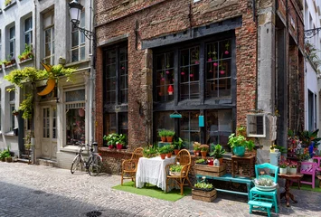 Foto auf Acrylglas Old street with flower shop in historic city center of Antwerpen (Antwerp), Belgium. Cozy cityscape of Antwerp. Architecture and landmark of Antwerpen © Ekaterina Belova