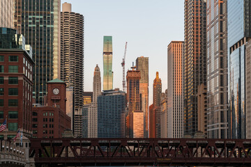 Panorama cityscape of Chicago downtown and River with bridges at sunset, Chicago, Illinois, USA. A vibrant business neighborhood