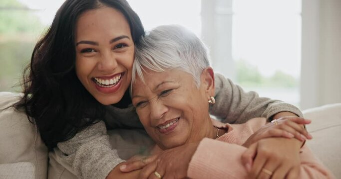 Happy, hug and face of woman with senior mother on sofa for bonding together in the living room. Smile, love and portrait of young female person embracing her elderly mom in retirement at modern home
