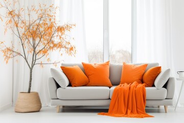 Beige sofa with orange cushions in the contemporary living room interior near the window