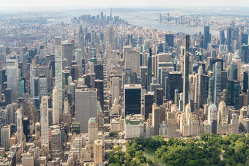 Aerial panoramic city view of Midtown Manhattan neighborhoods towards lower Manhattan and Downtown, Central Park on bottom, New York City. Bird's eye view from helicopter of metropolis cityscape