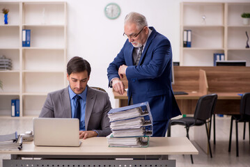 Two male colleagues working in the office