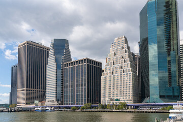 Fototapeta na wymiar Skyline of New York City Financial Downtown Skyscrapers over East River at day time, Manhattan, NYC, USA. A vibrant business neighborhood