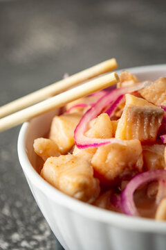 fish ceviche with onions and pepper. traditional peruvian food with tigra milk