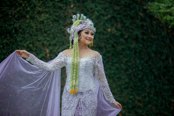 Amazing smiling bride. Traditional Javanese Bridal Portrait. Indonesian bride. Wedding day bride in...
